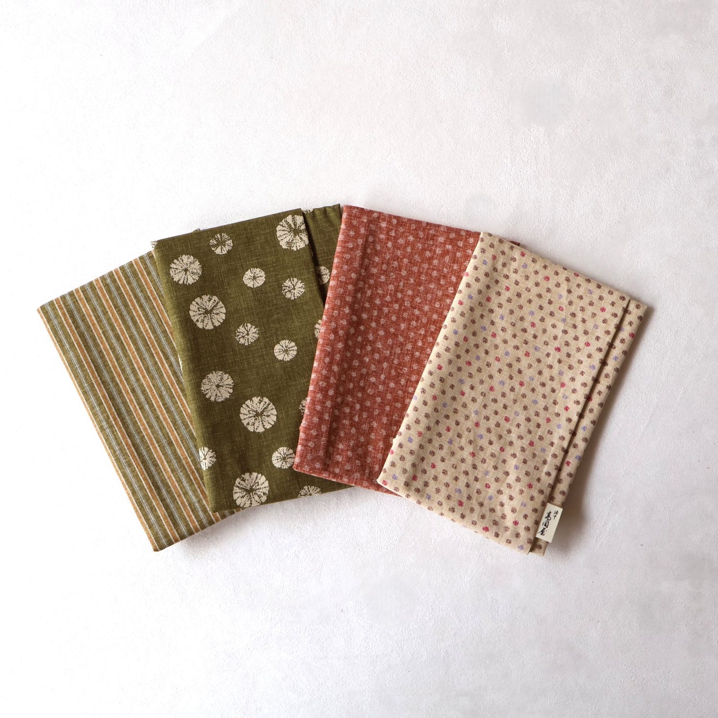座布団カバー | 綿生地 左から、縞みどり、絞り緑、あられピンク、三色あられ